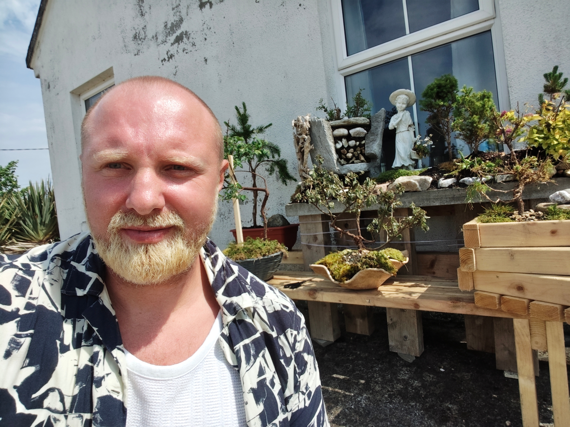 Daniel T. Firestone among his bonsai trees